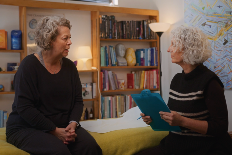 Therapist and client sitting in a CranioSacral Therapy consulting room